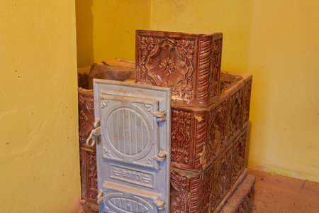 Brown ceramic tiles on the stove for heating. construction of a furnace for room heatingの写真素材