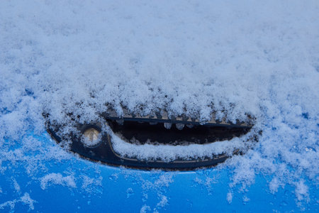 frozen car door and lock in winter, car door handle is locked.の写真素材