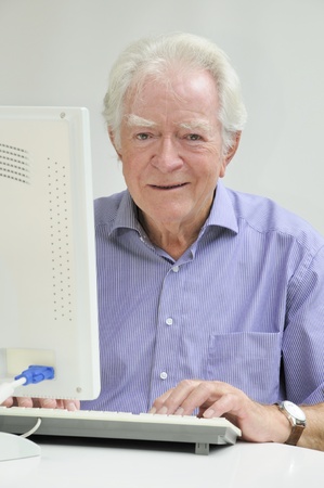 elderly man with laptopの写真素材