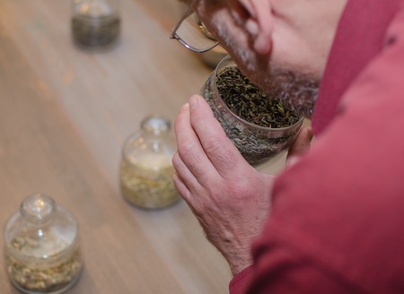 Aged man making tea on the kitchen