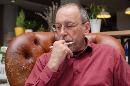 Closeup of aged man in glassesの写真素材