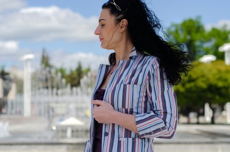 young girl walking on the cityの写真素材