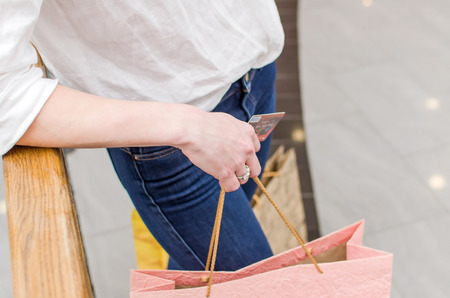 Woman with paper bags in the shopping mallの写真素材