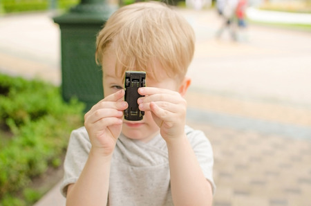 Small baby boy is playing in the parkの写真素材