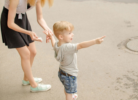 Small baby boy is having fun in the parkの写真素材