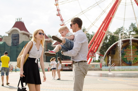 Young family is having fun in the parkの写真素材