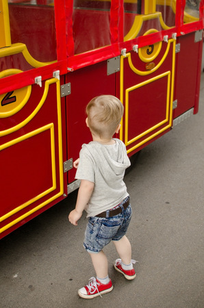 Small baby boy is having fun in the parkの写真素材