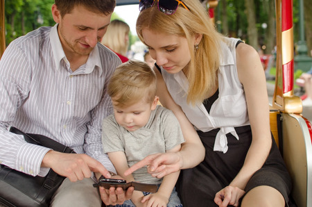 Young family is having fun in the park during the summerの写真素材