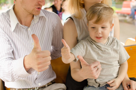 Young family is having fun in the park during the summerの写真素材
