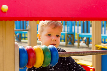 Close-up photo of small boy at the playgroundの写真素材