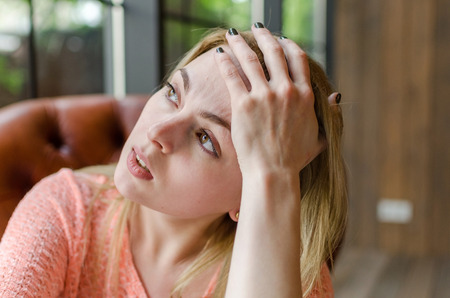 Close up of blonde young girl with brown eyesの写真素材