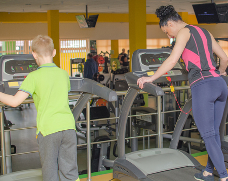 Mother and son are training in the race track