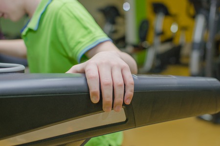 Boy is training on the race track in the sports clubの写真素材