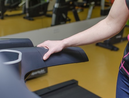 Young woman is training on the race trackの写真素材