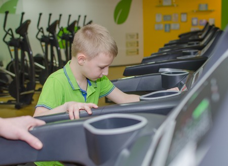 Mother and son are training in the race trackの写真素材