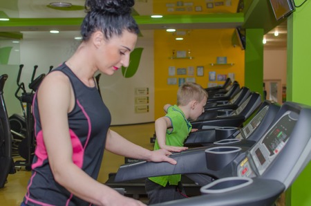 Mother and son are training in the race trackの写真素材