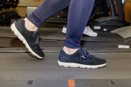 Young woman is training on the race trackの写真素材