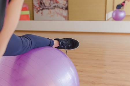 Young woman is making titness exercisesの写真素材