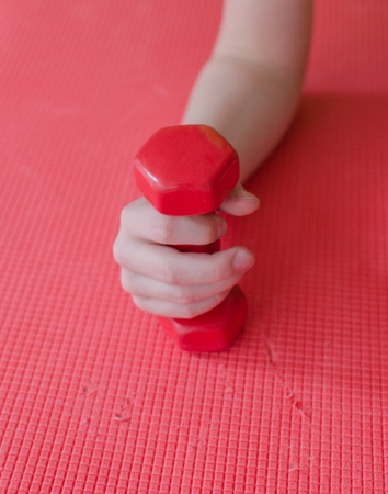 Young boy is making sports exercisesの写真素材