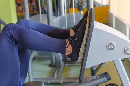 Young woman is training in the gym