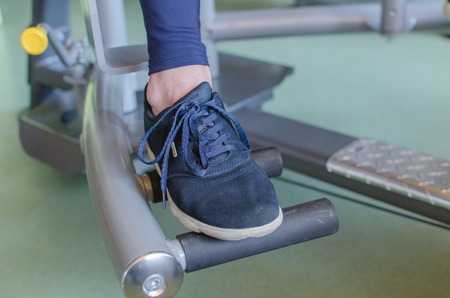 Young woman is training in the gym