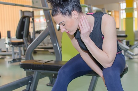 Young woman is training in the gym