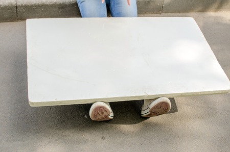 Young girl with the white banner in the cityの写真素材