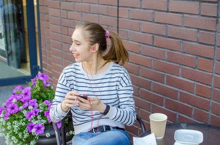 Young woman listening to music in headphonesの写真素材