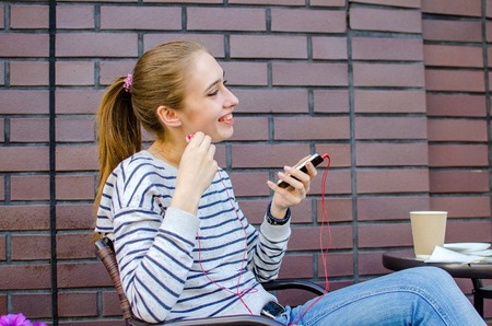 Young woman listening to music in headphonesの写真素材
