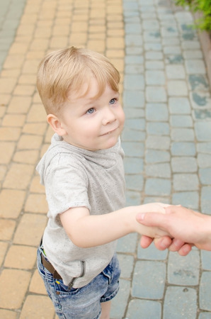 Small baby boy is having fun in the parkの写真素材