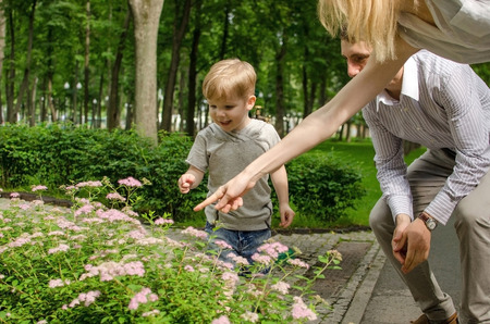 Young family is having fun in the parkの写真素材