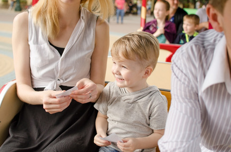 Young family is having fun in the park during the summerの写真素材