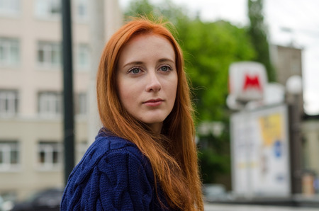 Young red woman walking and resting in the cityの写真素材
