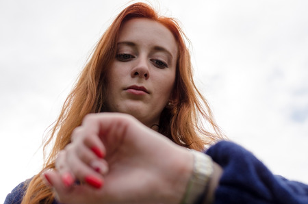 Young red woman walking and resting in the cityの写真素材
