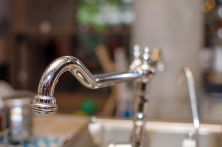 Closeup of silver tap on the kitchenの写真素材