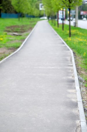 View to the empty road in the parkの写真素材
