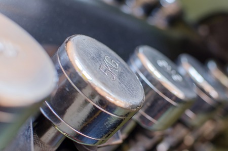Closeup of many silver barbells