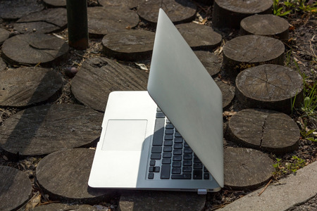 Laptop on wooden groundの写真素材