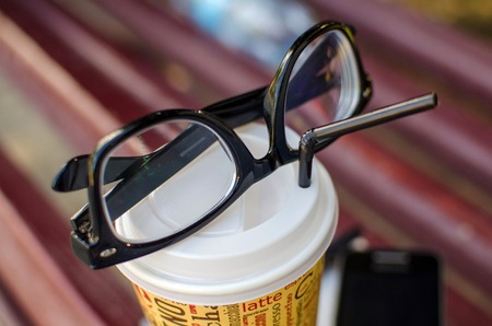 Closeup of cellphone with the glassesの写真素材