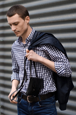Young man resting and walking in the sityの写真素材