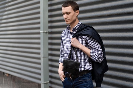 Young man resting and walking in the sity