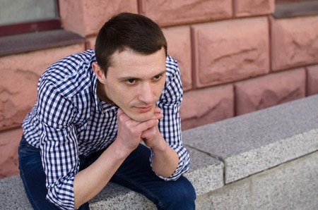 Young man resting and walking in the sityの写真素材