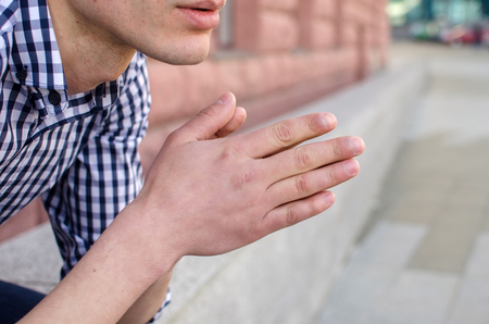 Young man resting and walking in the sityの写真素材