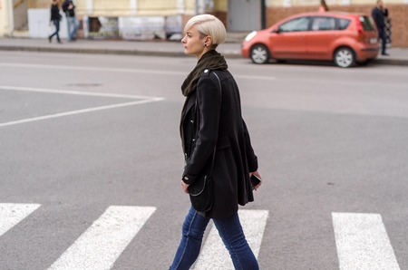 Young woman walking on the city streets