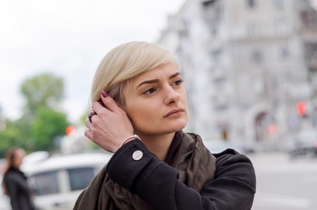 Young woman walking on the city streetsの写真素材