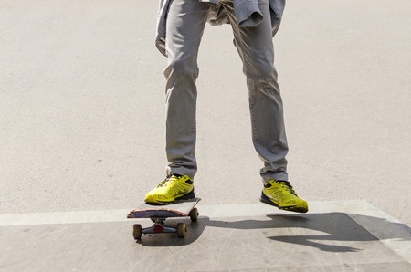 Young man with skateboard in the park