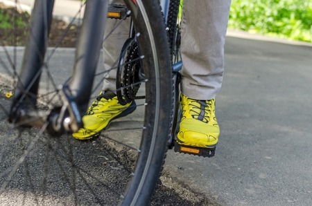 Young man with the bicycle in the parkの写真素材