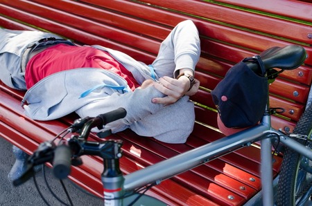 Young man with the bicycle in the parkの写真素材