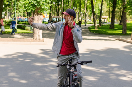 Young man with the bicycle in the parkの写真素材