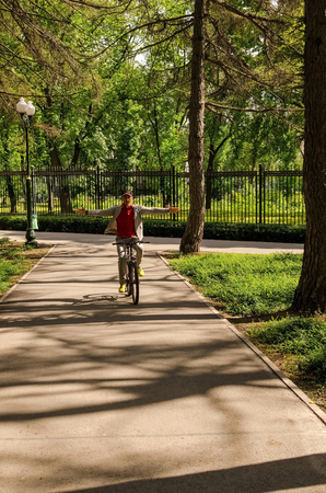 Young man with the bicycle in the parkの写真素材